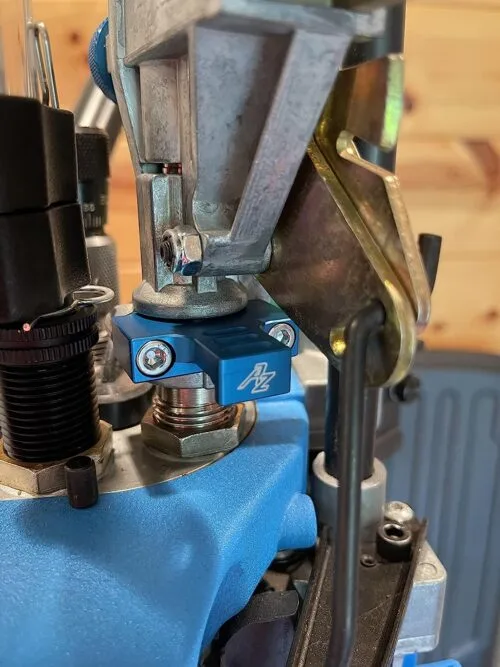 Close-up of blue mechanical component on machine.